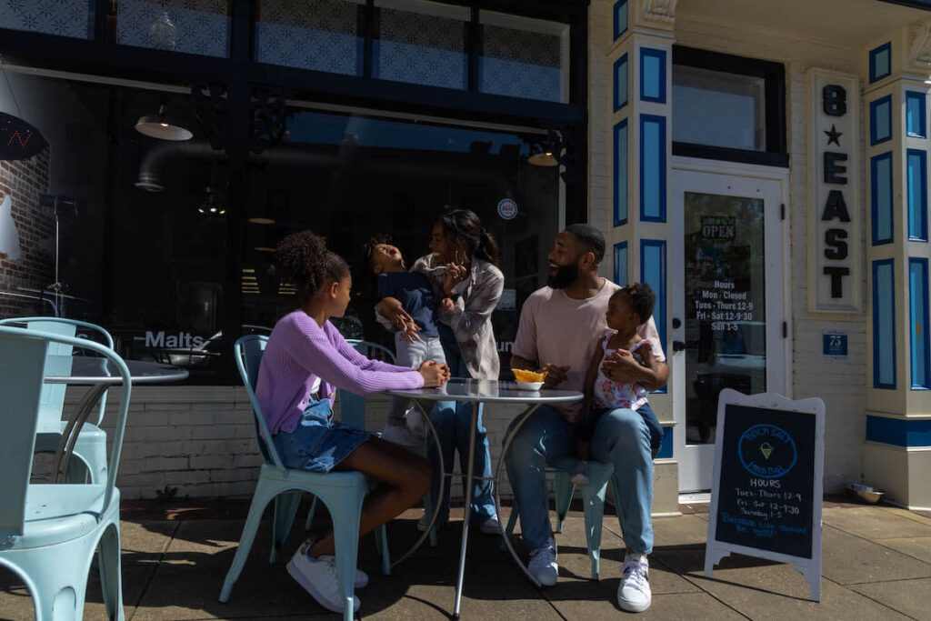 Toddler screaming with joy at ice cream shop