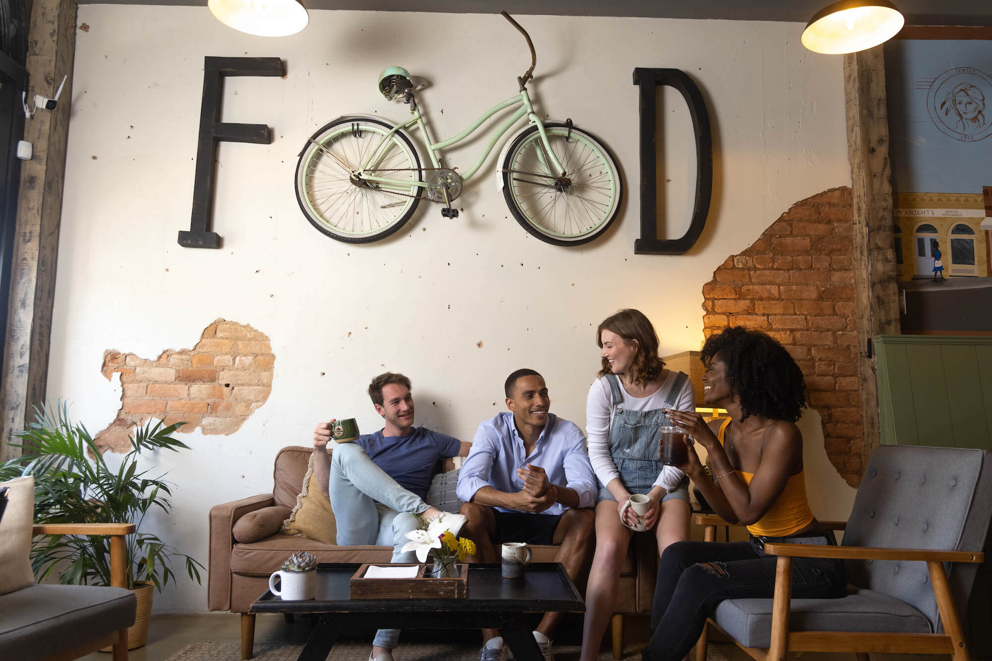 Four friends enjoying a coffee shop