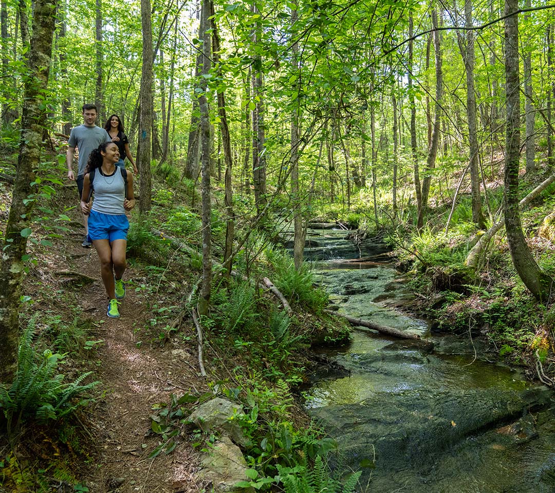 3 friends hiking the trails at Chattahoochee Bend State Park