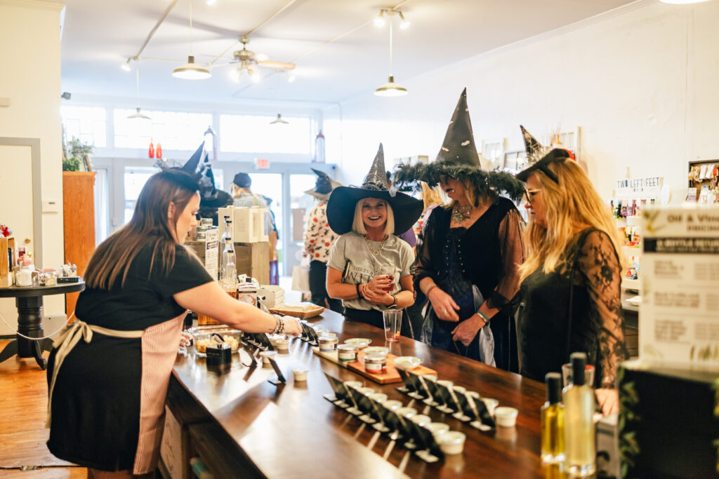 Ladies in witches hats shopping