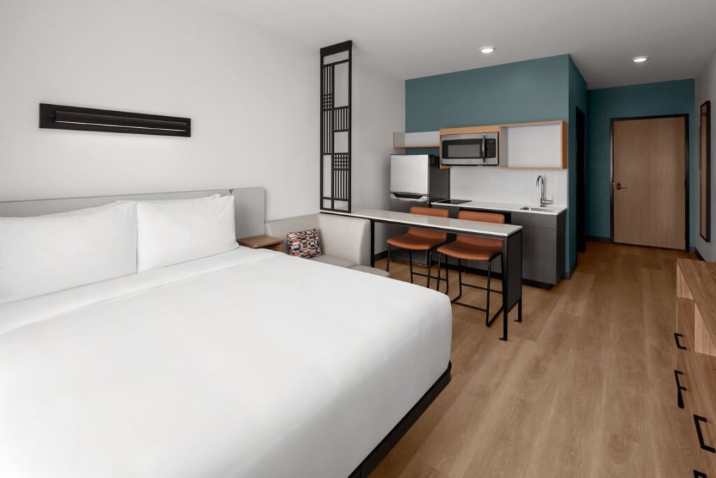 Hotel room showing bed, kitchenette and counter